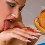 Naked Woman Eating a Hamburger Stock Image