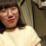 She looks like a serious eyeglasses with little expe...