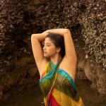 Desi model in a braless wet saree and showing glimpses her big boobs and nipples clearly while posing in a reef beach